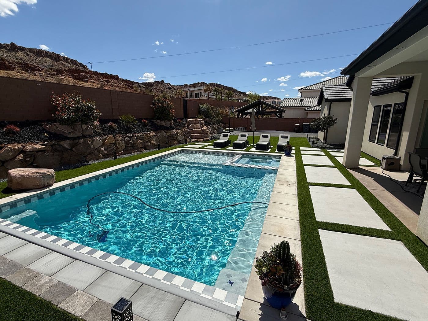 Stunning in-ground swimming pool with surrounding landscape